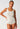 Front view of a women model wearing SK dune flowers cotton Tank top