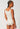 Back view of a women model wearing SK dune flowers cotton Tank top
