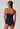 Back view of a women model wearing SK cheeky navy microfibre Camisole remov. pads