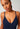 Close-up view of a women model wearing SK cheeky navy microfibre Camisole remov. pads