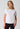 Front view of a women model wearing SK white cotton Shirt short sleeve
