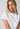 Close-up view of a women model wearing SK white cotton Shirt short sleeve