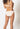 Back view of a women model wearing SK white cotton Bikini briefs 2 pack